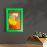 Vibrant abstract acrylic art with yellow, orange, and red tones in a bright green frame.