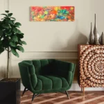Vibrant abstract acrylic artwork featuring reds, yellows, blues, and greens on a neutral wall.