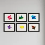 Abstract geometric shapes in red, green, and blue acrylic on a white background.