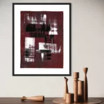 Abstract acrylic work in deep reds and browns, framed on a light wall.