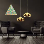 Triangular abstract artwork featuring vibrant blues, greens, and yellows on a dark wall.