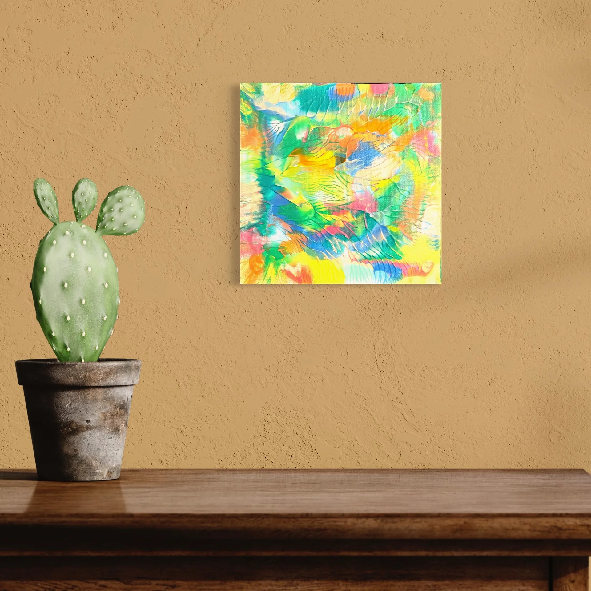Vibrant abstract acrylic art featuring bright yellows, greens, and blues on a solid wall.