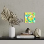 Vibrant abstract acrylic artwork featuring bright yellows, greens, and blues.