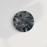 Dark, geometric oil painting featuring sharp, crystalline facets in shades of gray and black.