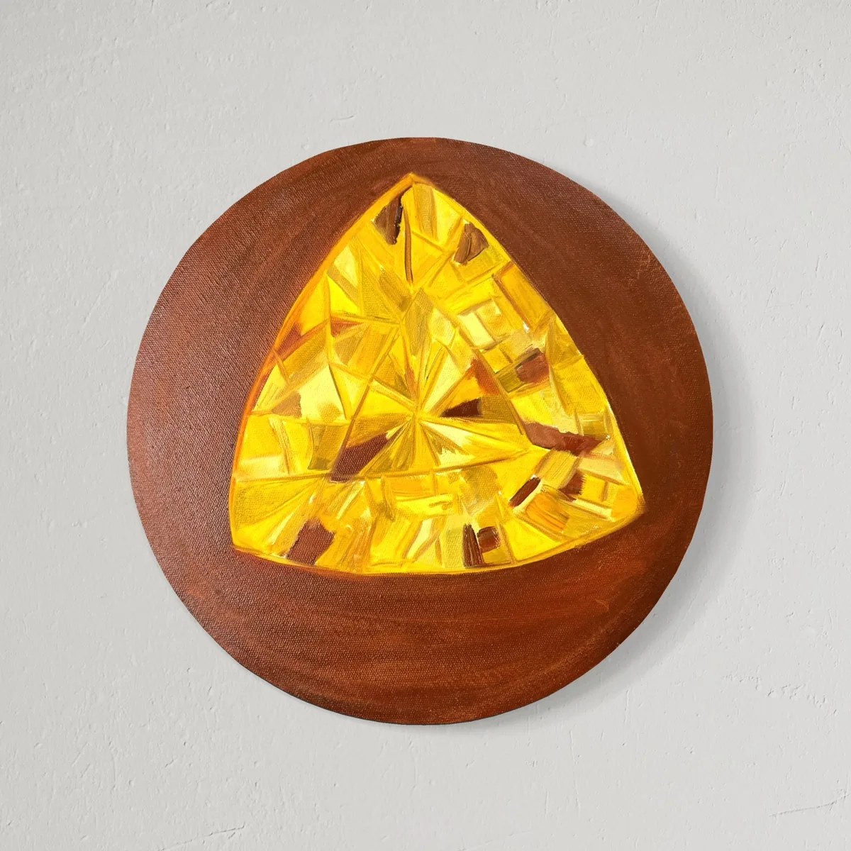 Yellow faceted gem shape on a round brown background, oil on canvas.