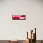 Abstract composition of red, pink, and white blocks within a black frame.