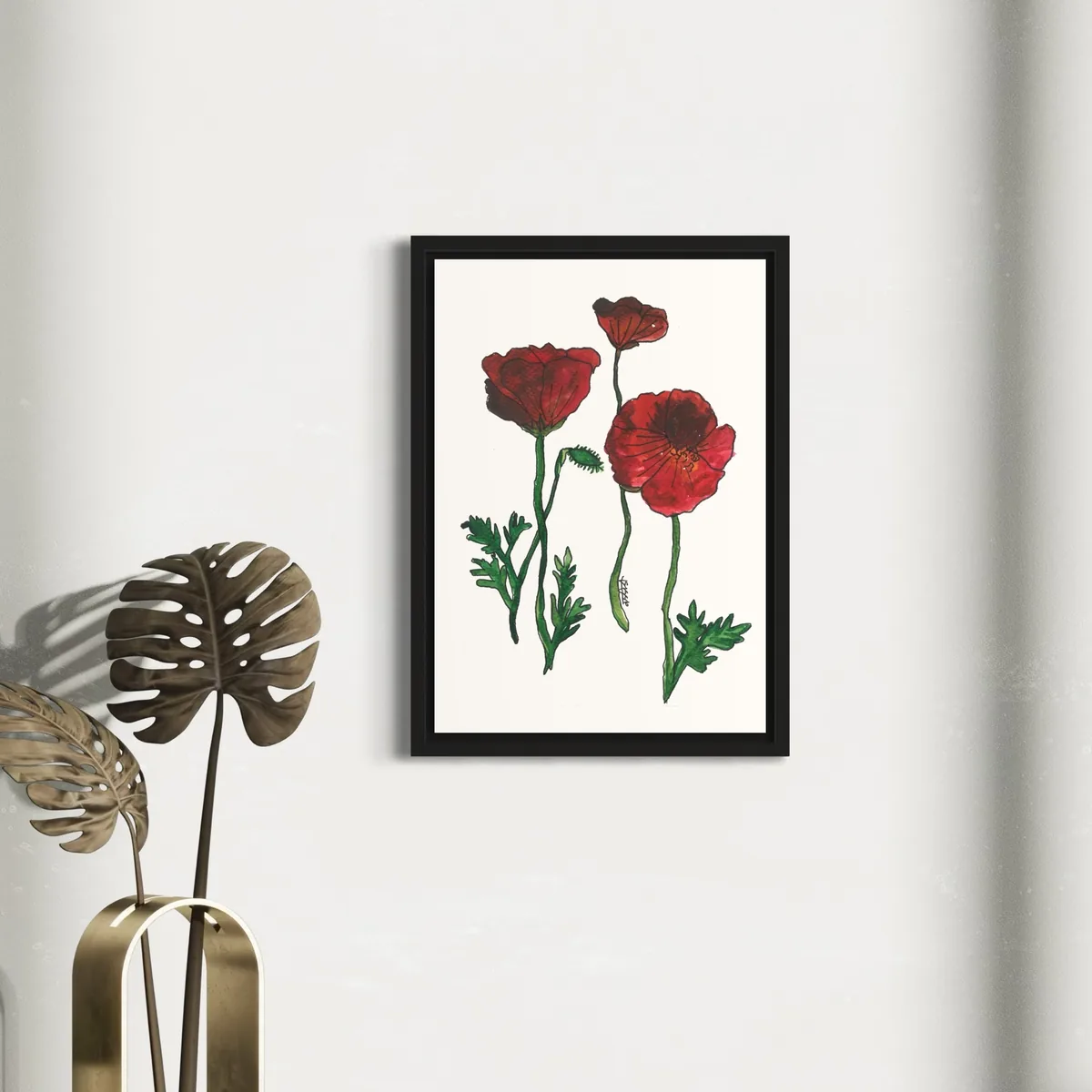 Vibrant red poppy watercolor on white background, framed in black.