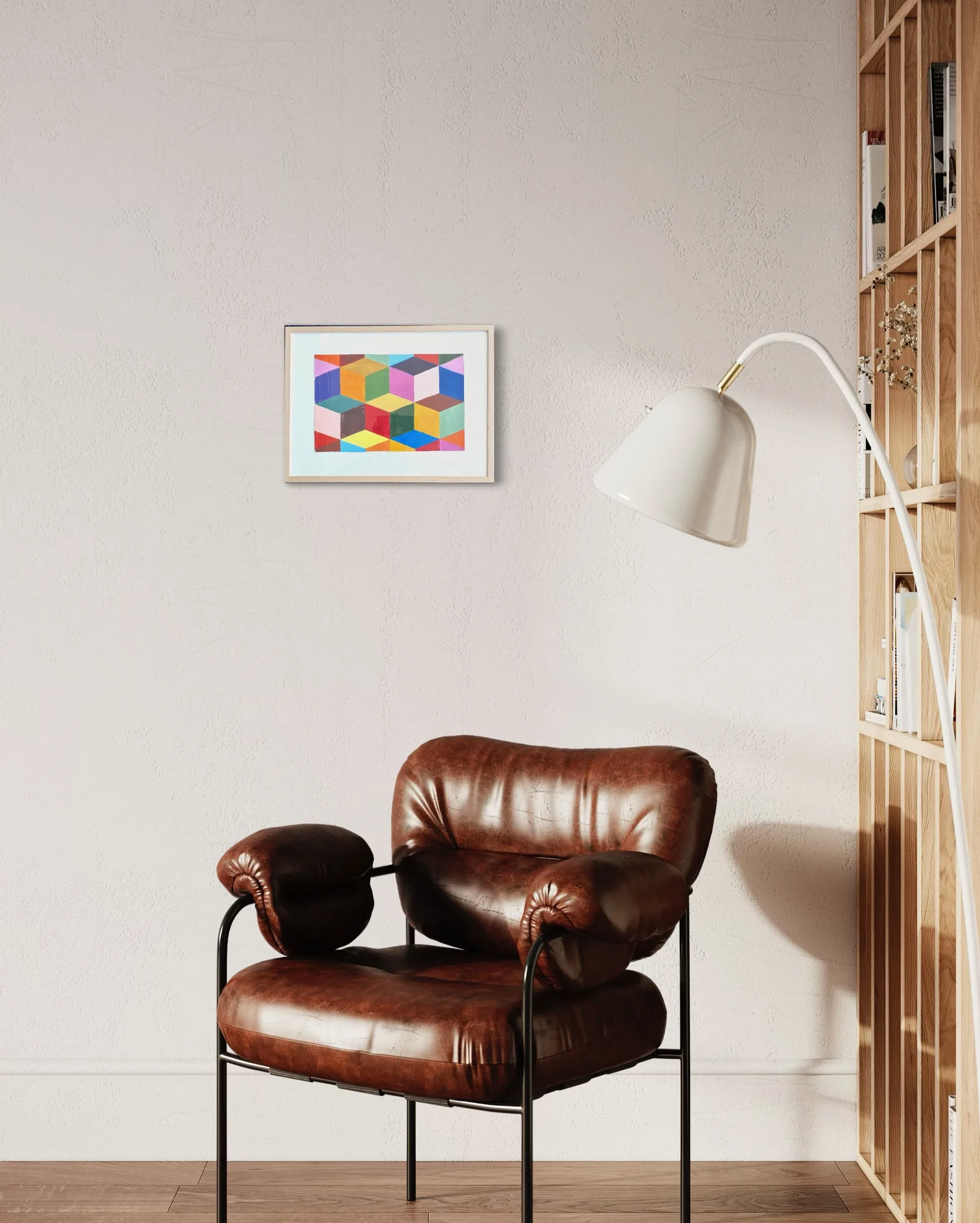 Abstract acrylic artwork with multi-colored geometric shapes in a simple frame on a light wall.