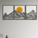 Black and white stylized mountains under a bright yellow circle, framed artwork.